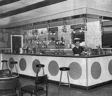 Interior view of the St George's Bar with barman Alexander Strang 1972.